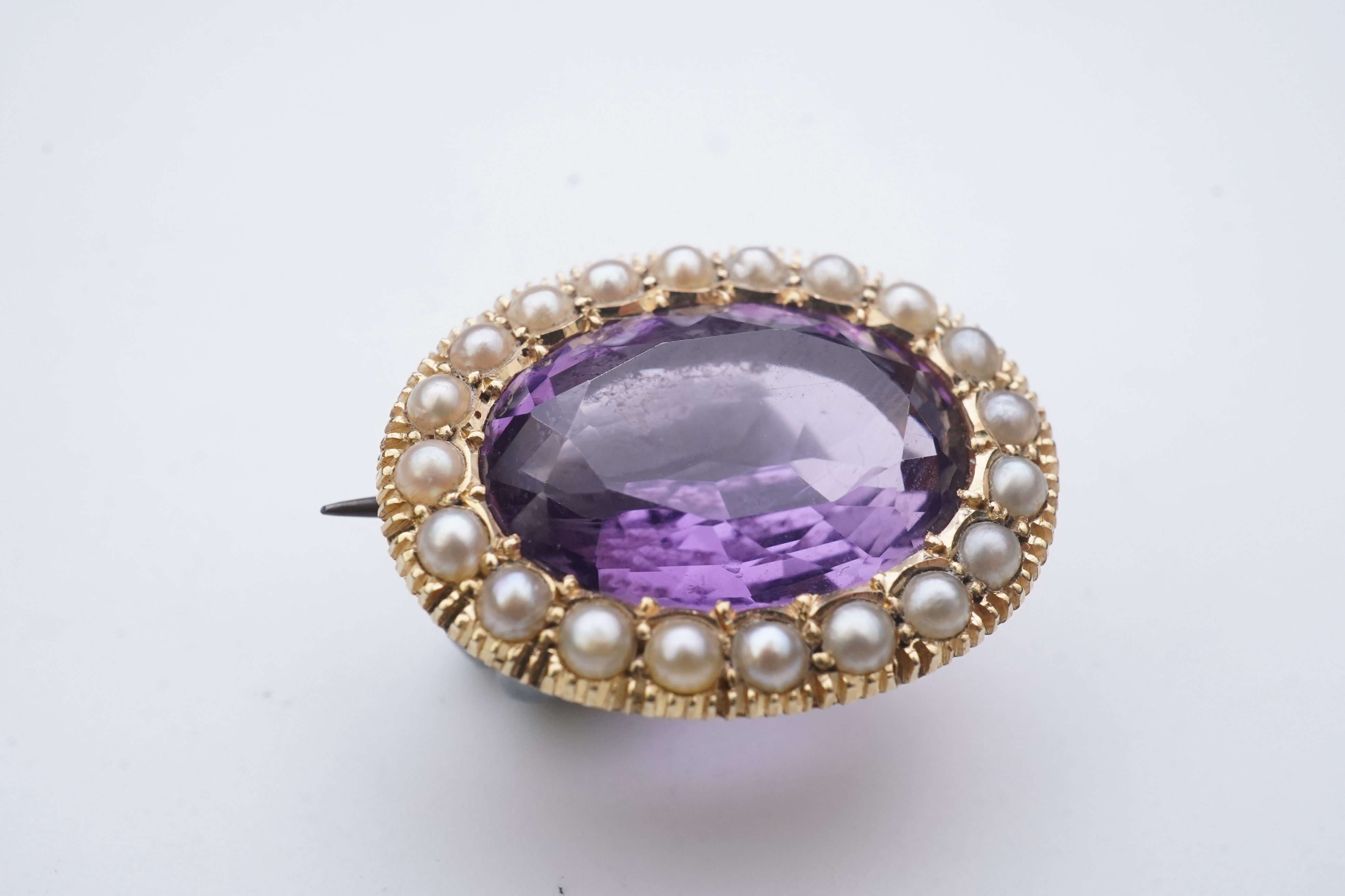 An amethyst brooch and an amethyst mourning ring, early 20th century